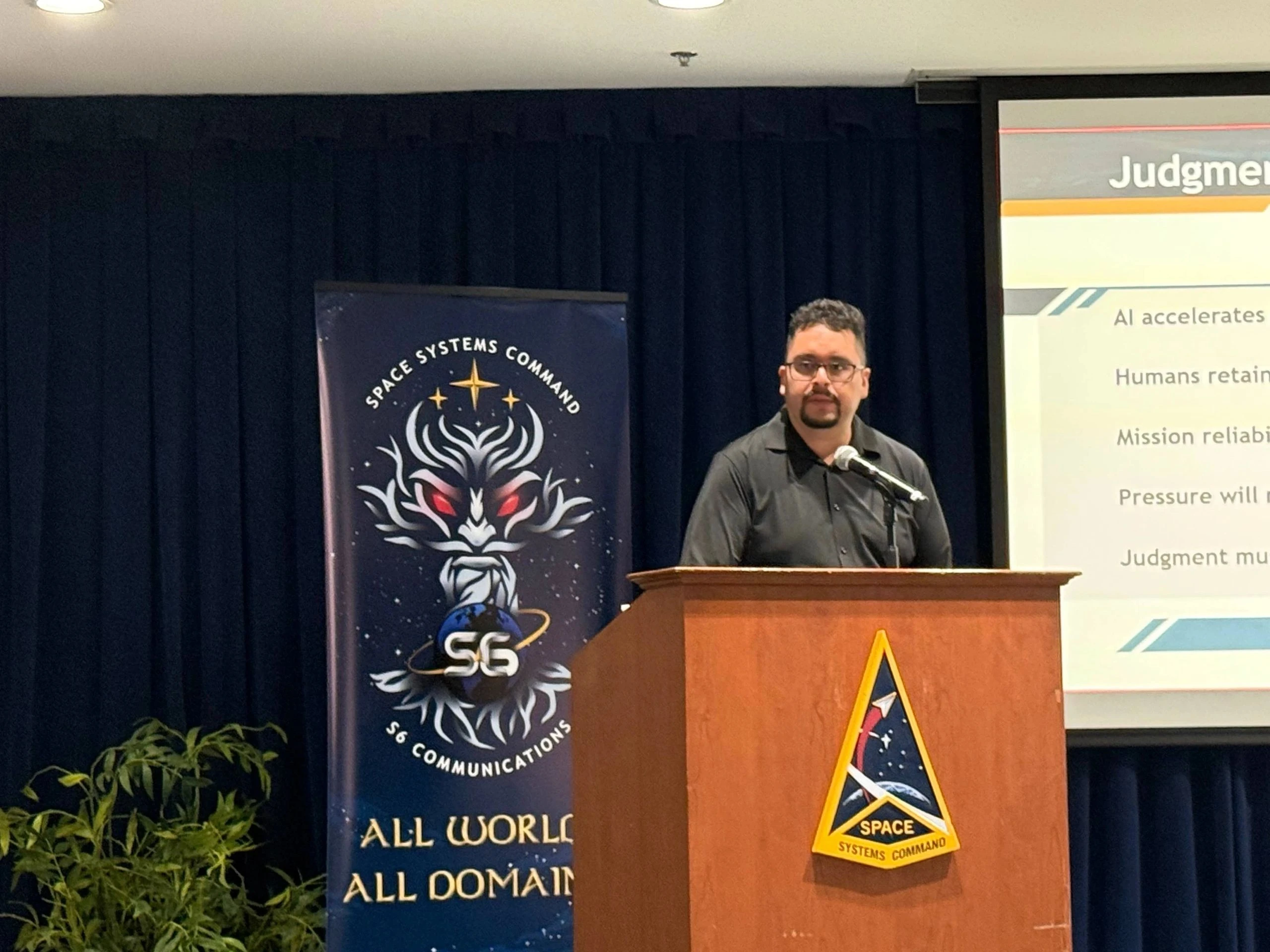 Dr. Hugo Velazco delivering keynote presentation on Judgment at Space Systems Command